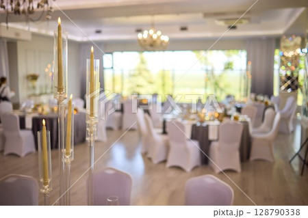An Elegant Event Venue featuring Candlelit Centerpieces and Exquisitely Refined An Elegant Event Venue featuring Candlelit Centerpieces and Exquisitely Refined 128790338