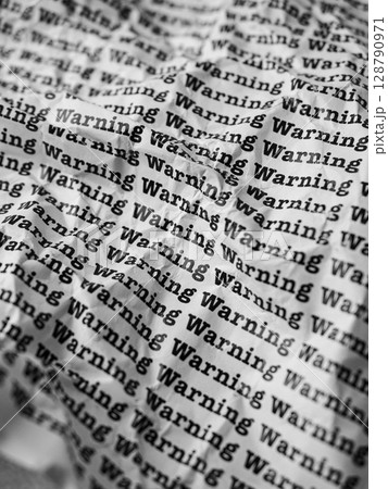 Words Warning Seamless print on crumpled paper for business background. 128790971