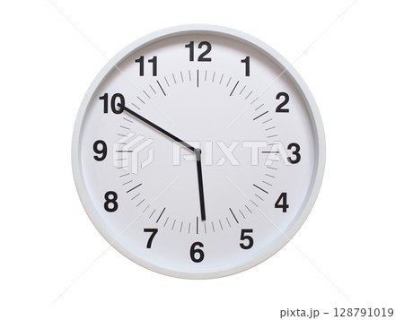 Simple white analog wall clock showing exactly 05:50 or 17:50. suitable for concepts like deadline, start or end of time. Isolated on a clean white background. 128791019