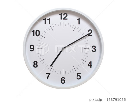 Simple white analog wall clock showing exactly 07:10 or 19:10. suitable for concepts like deadline, start or end of time. Isolated on a clean white background. Simple white analog wall clock showing exactly 07:10 or 19:10. suitable for concepts like deadline, start or end of time. Isolated on a clean white background. 128791036