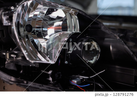 A Detailed Close Up View of an Automotive Headlight Assembly Displaying Quality and Craftsmanship 128791276