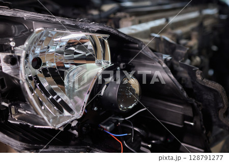 A Detailed Close Up View of an Automotive Headlight Assembly Displaying Quality and Craftsmanship 128791277