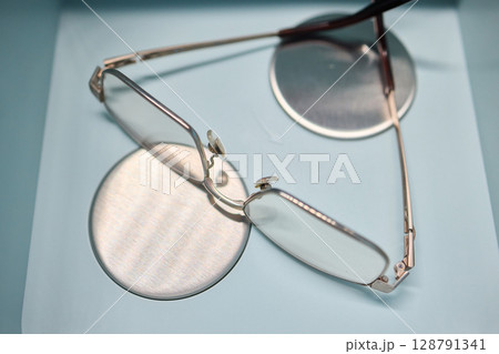 Eyewear care with our eyeglasses immersed in a state-of-the-art ultrasonic vibration cleaner. High-frequency vibrations to meticulously remove dirt and grime, ensuring your lenses are spotless. Eyewear care with our eyeglasses immersed in a state-of-the-art ultrasonic vibration cleaner. High-frequency vibrations to meticulously remove dirt and grime, ensuring your lenses are spotless. 128791341