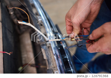 wrap lightning port with heat shrink tube and lighter on white background 128791368