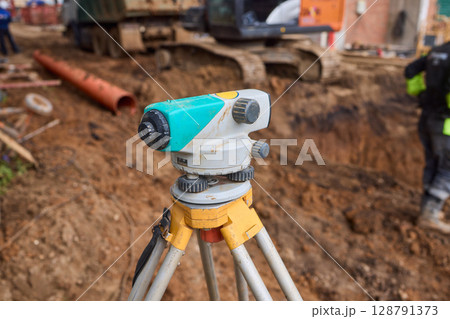 High Precision Surveying Equipment Utilized on a Construction Site for Enhanced Accuracy and Control 128791373