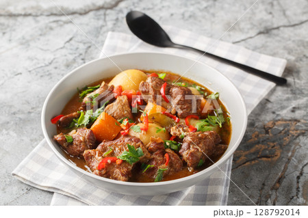 Semur Daging or Sweet Beef Stew closeup in the bowl. Horizontal 128792014