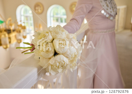 An Elegant Hand Resting on a White Bannister Adorned with Beautiful Delicate Fabric An Elegant Hand Resting on a White Bannister Adorned with Beautiful Delicate Fabric 128792876