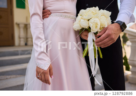 An Elegant and Heartwarming Bridal Handholding Moment to Cherish as a Beautiful Memory 128792886