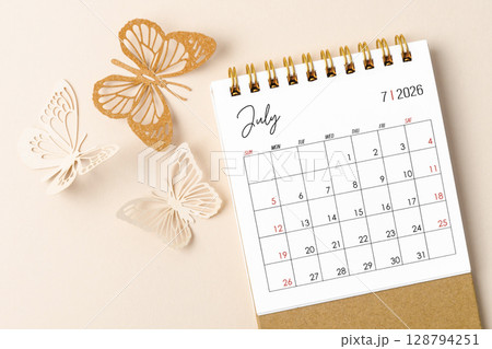 July 2026 desk calendar for the organizer to plan and reminder and butterfly paper on yellow background. 128794251