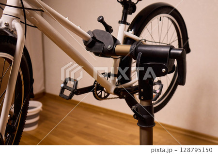 Utilizing a Bike Maintenance Setup Complete with a Repair Stand, Essential Tools, and More 128795150