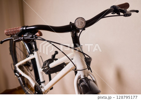 A stylish and modern bicycle handlebar designed with an LED light and integrated cables 128795177