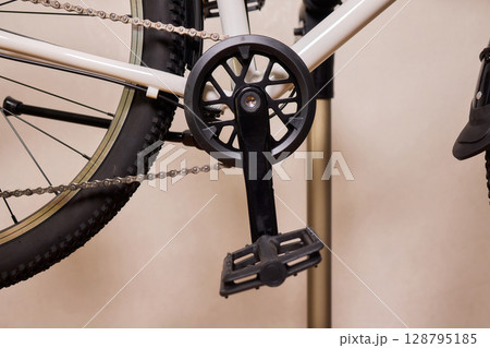 Close Up of a Bicycle Gear and Chain Highlighting Their Design and Functionality Close Up of a Bicycle Gear and Chain Highlighting Their Design and Functionality 128795185