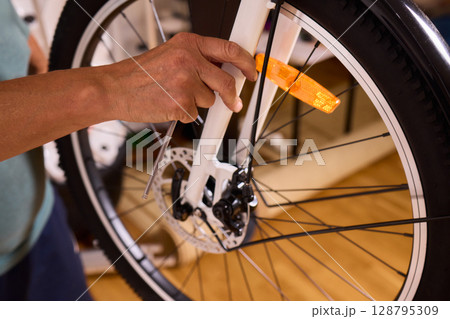 Close Up of a Bicycle Gear and Chain Highlighting Their Design and Functionality 128795309