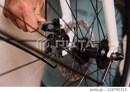 Close Up of a Bicycle Gear and Chain Highlighting Their Design and Functionality 128795313