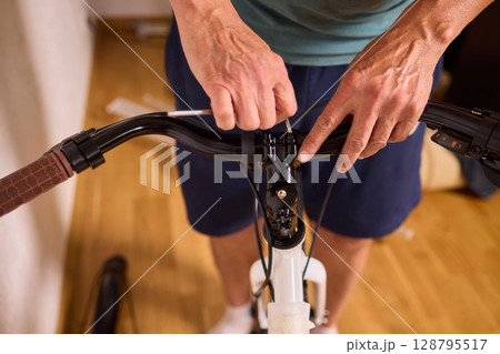 Bike Assembly in Progress Here is a Close Up View of The Entire Process Taking Place 128795517