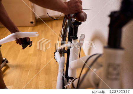 Bike Assembly in Progress Here is a Close Up View of The Entire Process Taking Place Bike Assembly in Progress Here is a Close Up View of The Entire Process Taking Place 128795537