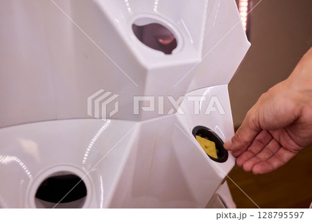 A Vertical Hydroponic Gardening System is actively in use for efficient plant cultivation A Vertical Hydroponic Gardening System is actively in use for efficient plant cultivation 128795597