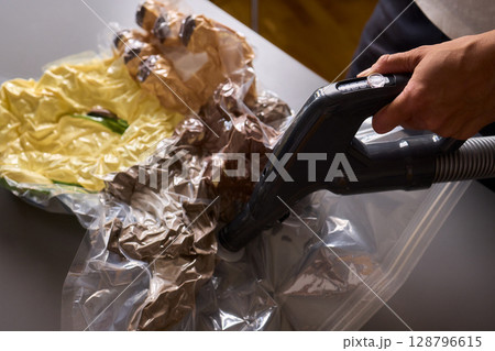Vacuum Packing Clothing for Effective Space Saving, Efficient Storage, and Better Organization 128796615