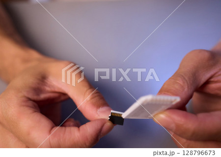 Comparison of SD and MicroSD Cards in Different Hands and Their Various Uses and Features 128796673