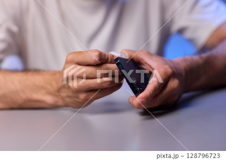 The Innovative Smartphone Cleaning Device is Being Demonstrated During Use and Functionality 128796723