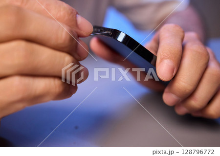 The Innovative Smartphone Cleaning Device is Being Demonstrated During Use and Functionality 128796772
