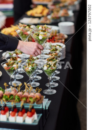 An Elegant Assortment of Gourmet Desserts and Savory Snacks Beautifully Arranged on Table 128797802
