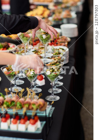 An Elegant Assortment of Gourmet Desserts and Savory Snacks Beautifully Arranged on Table 128797803