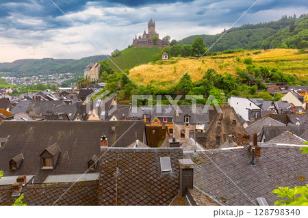 Reichsburg Cochem above rooftops in Cochem Germany 128798340