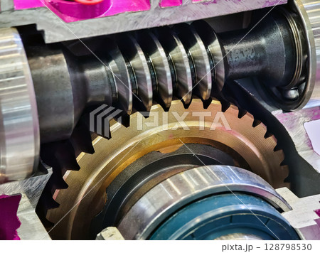 Detailed view of a mechanical gear system showcasing intricate design and engineering principles in industrial machinery 128798530