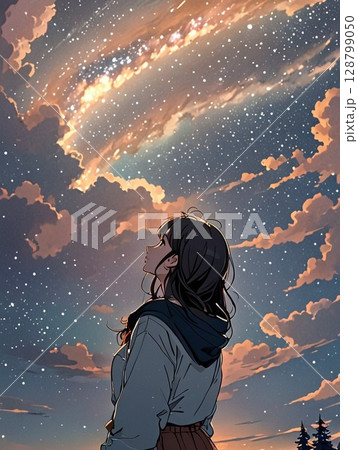 雲の下で夕焼けを見上げる少女 128799050