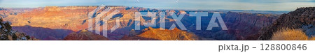 Wide Grand Canyon panorama with snowy rim 128800846