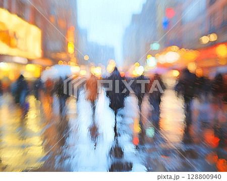 A rainy city square is viewed through a blurred, water-streaked window, showing abstract shapes of people and glowing neon lights in blue, orange, and yellow. 128800940