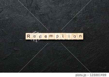 redemption word written on wood block. redemption text on cement table for your desing, concept redemption word written on wood block. redemption text on cement table for your desing, concept 128801499