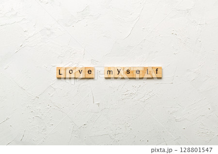 Love myself word written on wood block. Love myself text on cement table for your desing, Top view concept 128801547