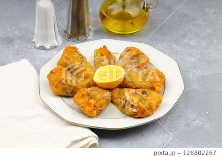 Pumpkin or Zucchini Flowers Dolma Stuffed with Rice Pilaf . Turkish Food in Plate. Traditional Organic Food. 128802267