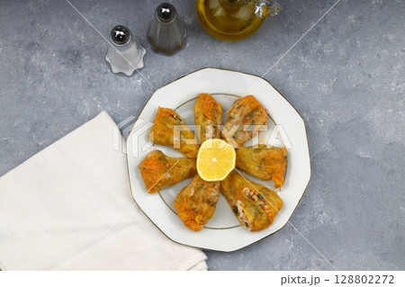 Pumpkin or Zucchini Flowers Dolma Stuffed with Rice Pilaf . Turkish Food in Plate. Traditional Organic Food. 128802272