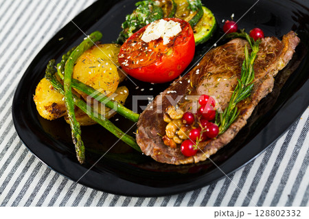 Image of veal with baked vegetables 128802332