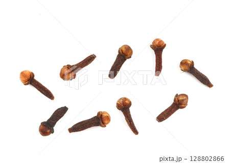 Dry cloves isolated on white background. Top view. Flat lay 128802866