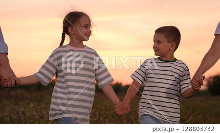 mother father children boy girl park sunset, man woman toddlers outdoors, Sure Here are 10 options for image titles in English, separated by commas: 128803732