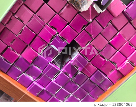 Vibrant display of stacked packaging showcasing colorful design elements 128804065