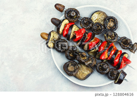 Grilled vegetables on skewers. Grilled vegetables on skewers. 128804616