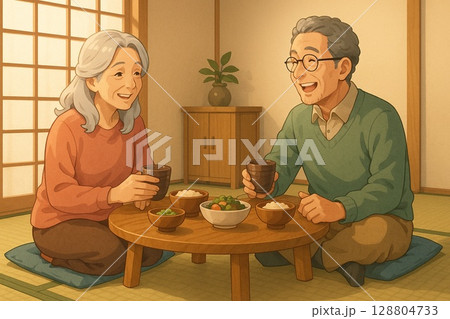 和風の食卓で会話を楽しむ高齢者 128804733