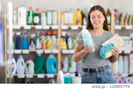 Woman chooses gel and washcloth Woman chooses gel and washcloth 128805778