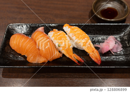 Delicious Shrimp and Salmon Nigiri Sushi with Pickled Ginger and Soy Sauce 128806899