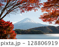 Mount Fuji rising over lake and colorful autumn foliage in Japan 128806919