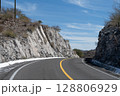 Winding mountain road passing through rocky cliffs in Sonora, Mexico 128806929