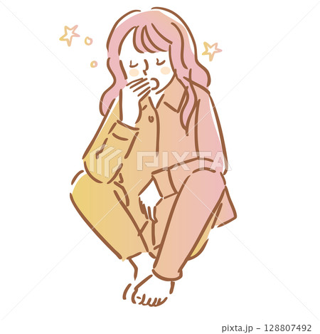 座りながら眠くてあくびをするパジャマ姿の女性 128807492