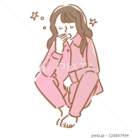 座りながら眠くてあくびをするパジャマ姿の女性 128807494
