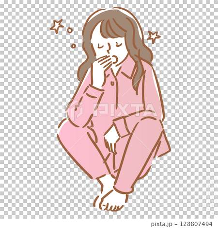 座りながら眠くてあくびをするパジャマ姿の女性 128807494