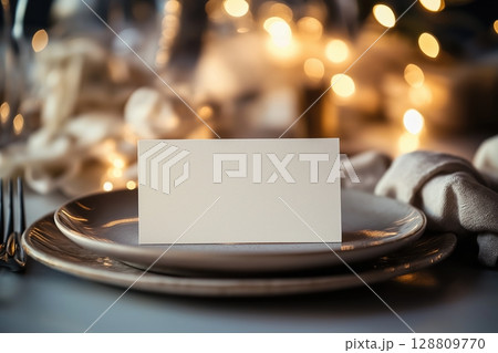 Minimalist wedding place card on an elegant table setting Minimalist wedding place card on an elegant table setting 128809770